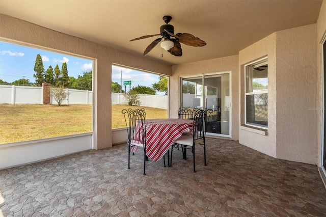 2812 Hickory Ridge Dr, Lakeland, FL 33813 - sunroom / solarium with plenty of natural light, a ceiling fan, outdoor dining space, and stone finish floor