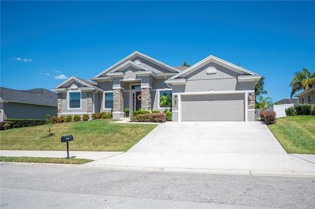 5531 Pebble Beach Dr, Lakeland, FL 33812 - craftsman inspired home featuring stone siding, a garage, stucco siding, a front yard, and driveway