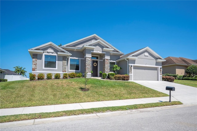 5531 Pebble Beach Dr, Lakeland, FL 33812 - craftsman house with a front lawn, stucco siding, driveway, and stone siding