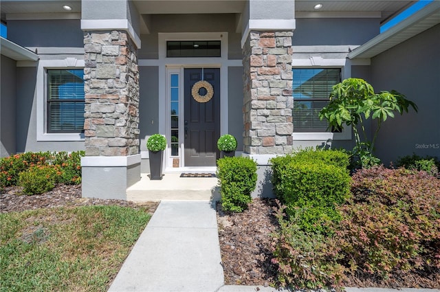 5531 Pebble Beach Dr, Lakeland, FL 33812 - entrance to property featuring stone siding and stucco siding