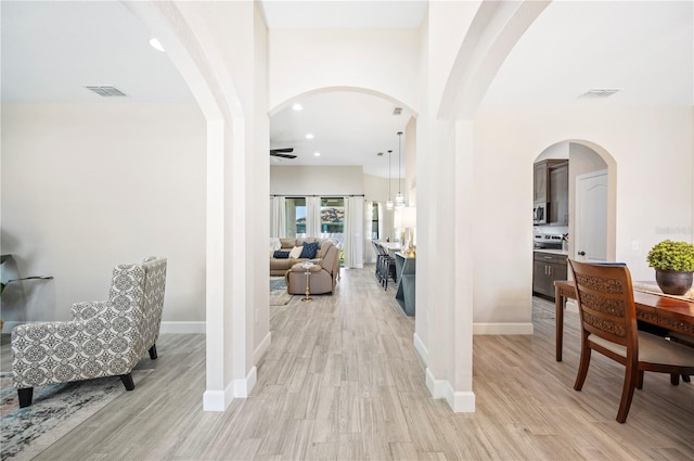 5531 Pebble Beach Dr, Lakeland, FL 33812 - hall with recessed lighting, baseboards, light wood finished floors, and visible vents