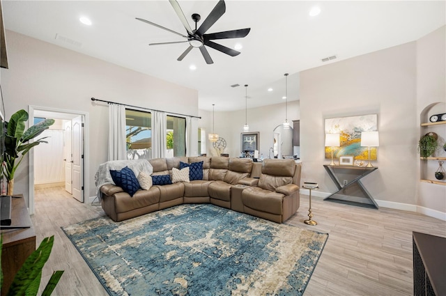5531 Pebble Beach Dr, Lakeland, FL 33812 - living area featuring a ceiling fan, baseboards, visible vents, and light wood-style floors