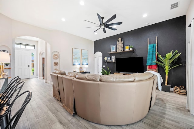 5531 Pebble Beach Dr, Lakeland, FL 33812 - living room featuring ceiling fan, visible vents, arched walkways, light wood finished floors, and recessed lighting