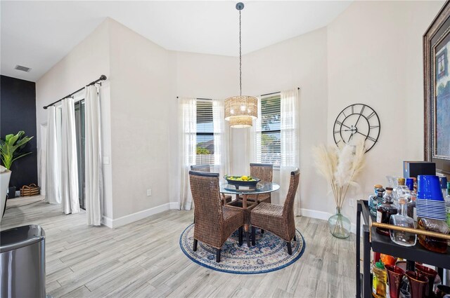 5531 Pebble Beach Dr, Lakeland, FL 33812 - dining area featuring baseboards, visible vents, and light wood-style floors