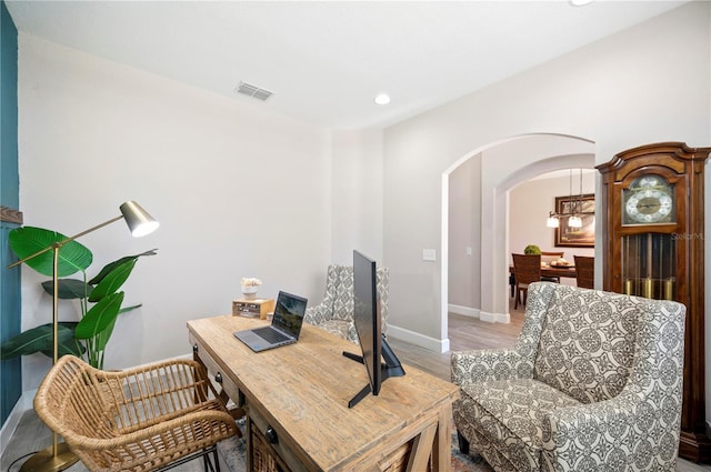 5531 Pebble Beach Dr, Lakeland, FL 33812 - office space featuring visible vents, arched walkways, baseboards, light wood-style floors, and recessed lighting