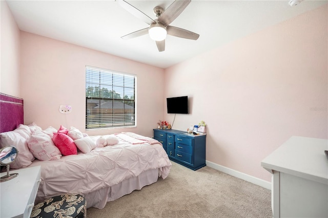 5531 Pebble Beach Dr, Lakeland, FL 33812 - bedroom featuring a ceiling fan, baseboards, and light carpet