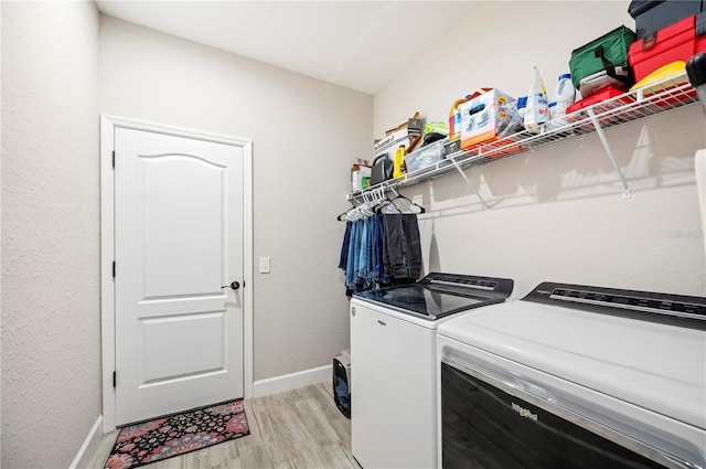 5531 Pebble Beach Dr, Lakeland, FL 33812 - laundry room featuring separate washer and dryer, laundry area, baseboards, and light wood-style floors