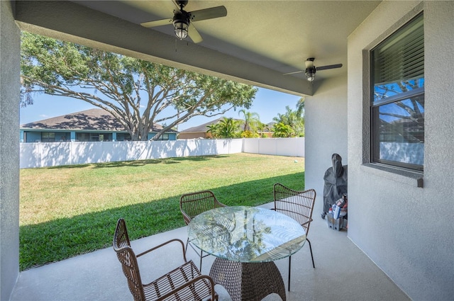5531 Pebble Beach Dr, Lakeland, FL 33812 - view of patio with outdoor dining area, a ceiling fan, and a fenced backyard
