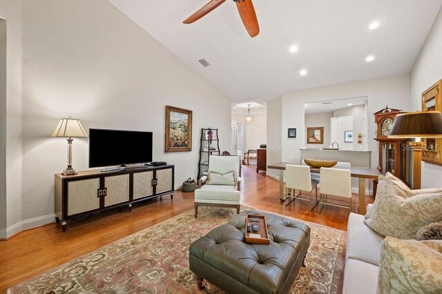 2965 Mission Lakes Dr, Lakeland, FL 33803 - living area with a ceiling fan, lofted ceiling, wood finished floors, baseboards, and recessed lighting