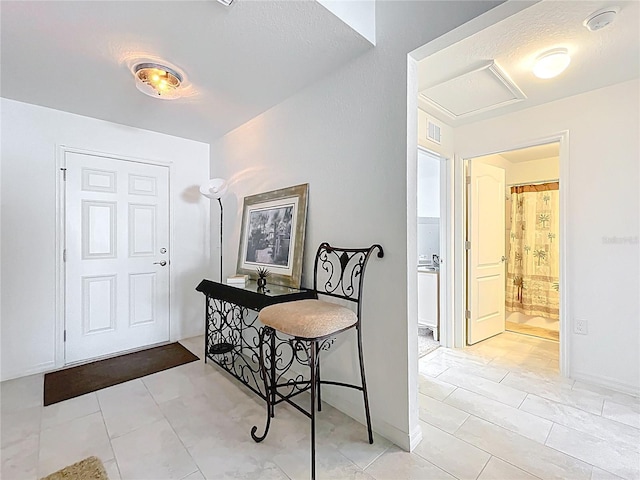 entryway with visible vents and light tile patterned floors