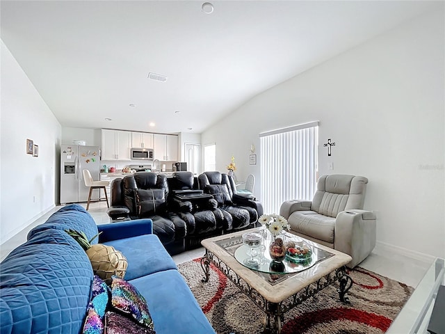 living room with visible vents and baseboards