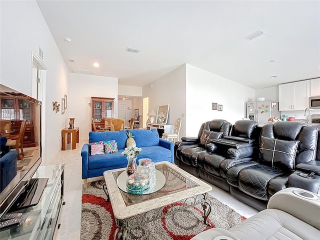 living room with visible vents and light tile patterned floors