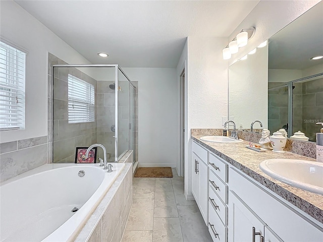 full bathroom with a sink, double vanity, a stall shower, and a bath