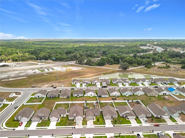 bird's eye view with a residential view and a forest view