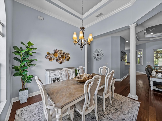 800 Osprey Landing Dr, Lakeland, FL 33813 - dining space with a raised ceiling, decorative columns, hardwood / wood-style flooring, ornamental molding, and a chandelier