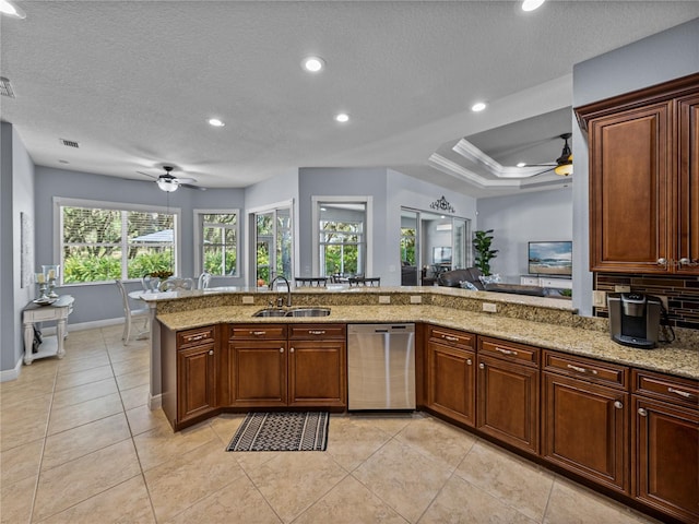800 Osprey Landing Dr, Lakeland, FL 33813 - kitchen featuring a ceiling fan, stainless steel dishwasher, a sink, light stone counters, and recessed lighting