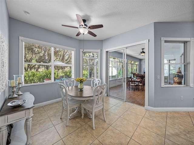 800 Osprey Landing Dr, Lakeland, FL 33813 - dining space with a ceiling fan, baseboards, light tile patterned floors, and a textured ceiling