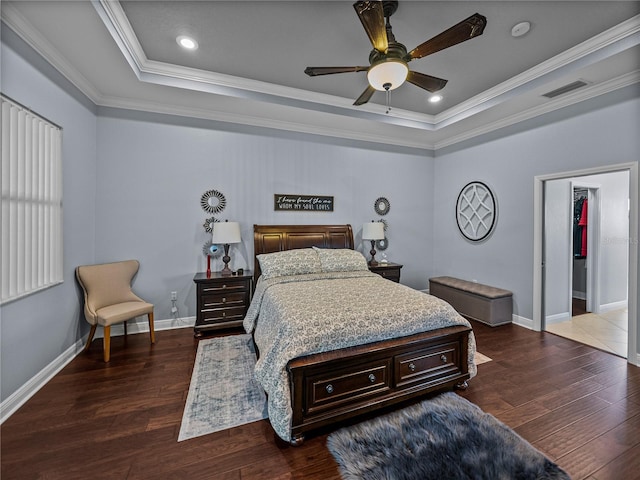 800 Osprey Landing Dr, Lakeland, FL 33813 - bedroom featuring a raised ceiling, dark wood-style floors, crown molding, baseboards, and recessed lighting