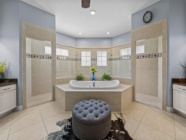 800 Osprey Landing Dr, Lakeland, FL 33813 - full bathroom with walk in shower, tile patterned floors, a bath, a ceiling fan, and recessed lighting