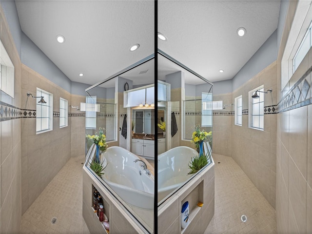 800 Osprey Landing Dr, Lakeland, FL 33813 - full bath featuring a garden tub, a walk in shower, recessed lighting, and vanity
