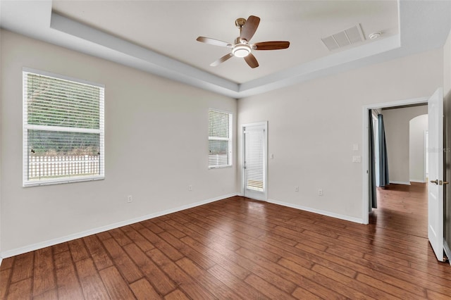 3592 Prescott Loop, Lakeland, FL 33810 - unfurnished room featuring a healthy amount of sunlight, a raised ceiling, ceiling fan, and visible vents