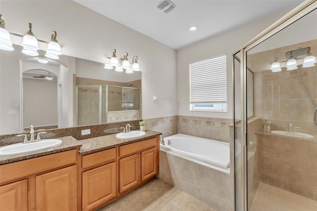 3592 Prescott Loop, Lakeland, FL 33810 - bathroom featuring tile patterned flooring, a shower stall, a sink, and a bath