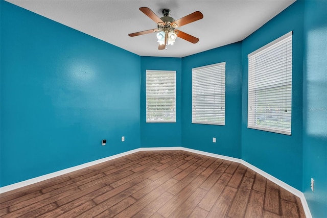 3592 Prescott Loop, Lakeland, FL 33810 - empty room featuring baseboards, a ceiling fan, and wood finished floors