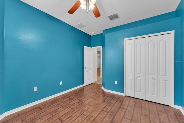 3592 Prescott Loop, Lakeland, FL 33810 - unfurnished bedroom featuring a ceiling fan, baseboards, wood finished floors, visible vents, and a closet