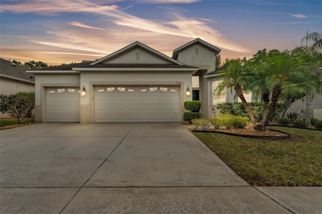 3592 Prescott Loop, Lakeland, FL 33810 - view of front of property with concrete driveway, stucco siding, and an attached garage