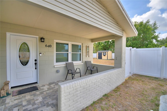 property entrance with fence