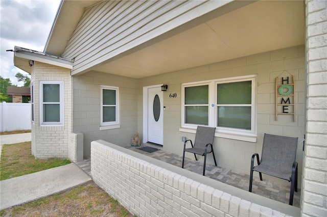 doorway to property featuring covered porch