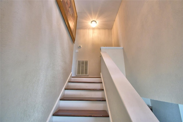 staircase with visible vents