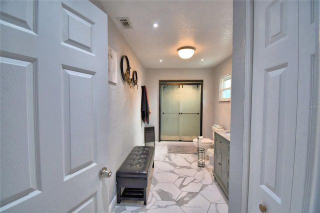 interior space with vanity, tile patterned flooring, visible vents, baseboards, and recessed lighting
