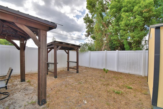 view of yard featuring a gazebo and a fenced backyard