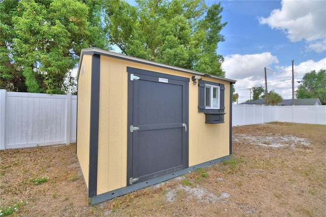 view of shed featuring a fenced backyard