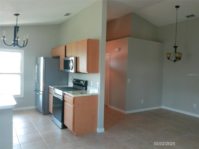 kitchen with visible vents, appliances with stainless steel finishes, light countertops, a notable chandelier, and light tile patterned flooring