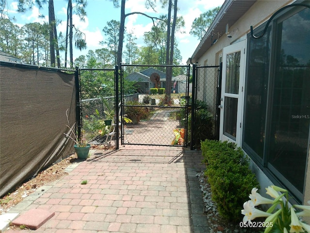view of gate featuring fence