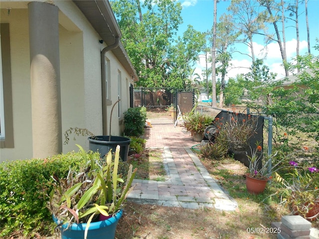 view of yard with fence and a gate