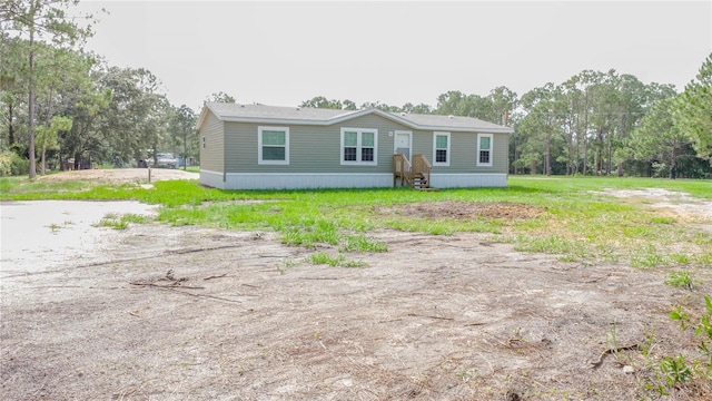 1619 N Lone Bay Blvd, Avon Park, FL 33825 - manufactured / mobile home with view of scattered trees