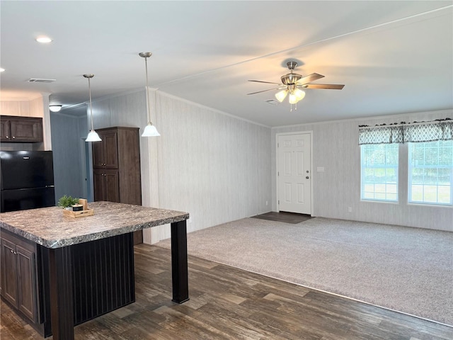 1619 N Lone Bay Blvd, Avon Park, FL 33825 - kitchen with ornamental molding, dark wood-style flooring, dark brown cabinets, and freestanding refrigerator