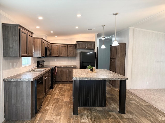 1619 N Lone Bay Blvd, Avon Park, FL 33825 - kitchen with black appliances, crown molding, a kitchen island, backsplash, and dark wood-style flooring