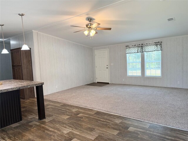 1619 N Lone Bay Blvd, Avon Park, FL 33825 - unfurnished living room with ornamental molding, ceiling fan, and dark wood-type flooring