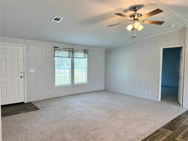 1619 N Lone Bay Blvd, Avon Park, FL 33825 - unfurnished living room featuring ornamental molding, a ceiling fan, carpet floors, and wood finished floors