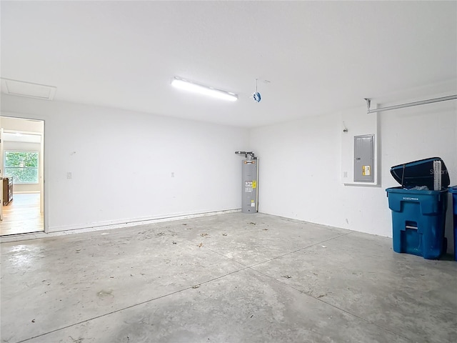 garage with electric water heater and electric panel