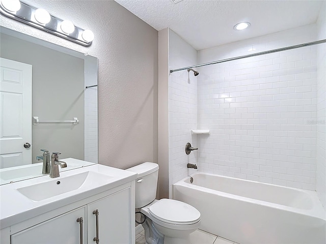 full bathroom featuring toilet, vanity, a textured ceiling, shower / bath combination, and tile patterned flooring