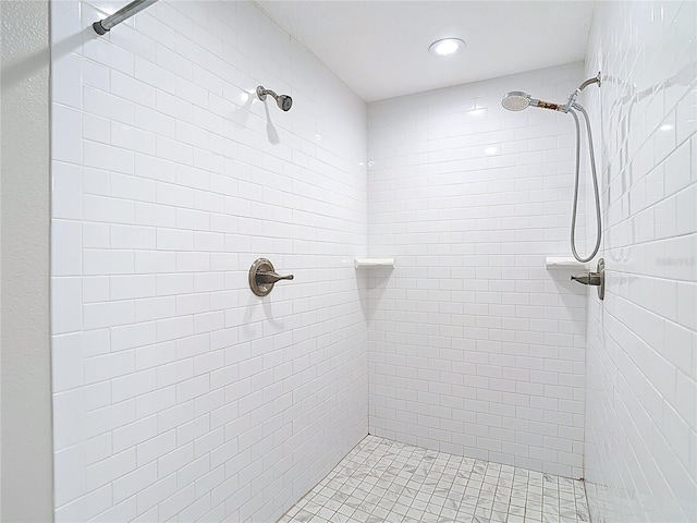 bathroom featuring tiled shower