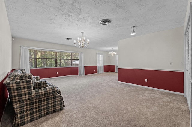 3441 Sherertz Rd, Lakeland, FL 33810 - living area with a chandelier, a textured ceiling, carpet flooring, and baseboards