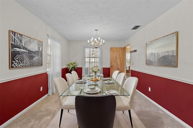 3441 Sherertz Rd, Lakeland, FL 33810 - dining space with carpet flooring, a chandelier, and baseboards