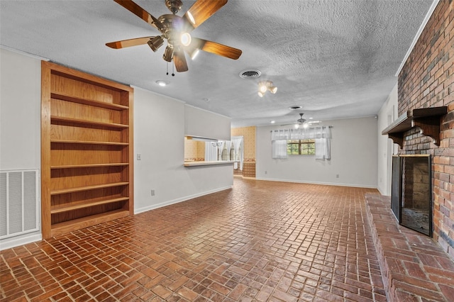 3441 Sherertz Rd, Lakeland, FL 33810 - unfurnished living room with ceiling fan, baseboards, brick floors, a brick fireplace, and built in shelves