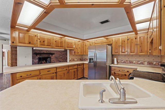 3441 Sherertz Rd, Lakeland, FL 33810 - kitchen with stainless steel fridge with ice dispenser, a sink, and light countertops